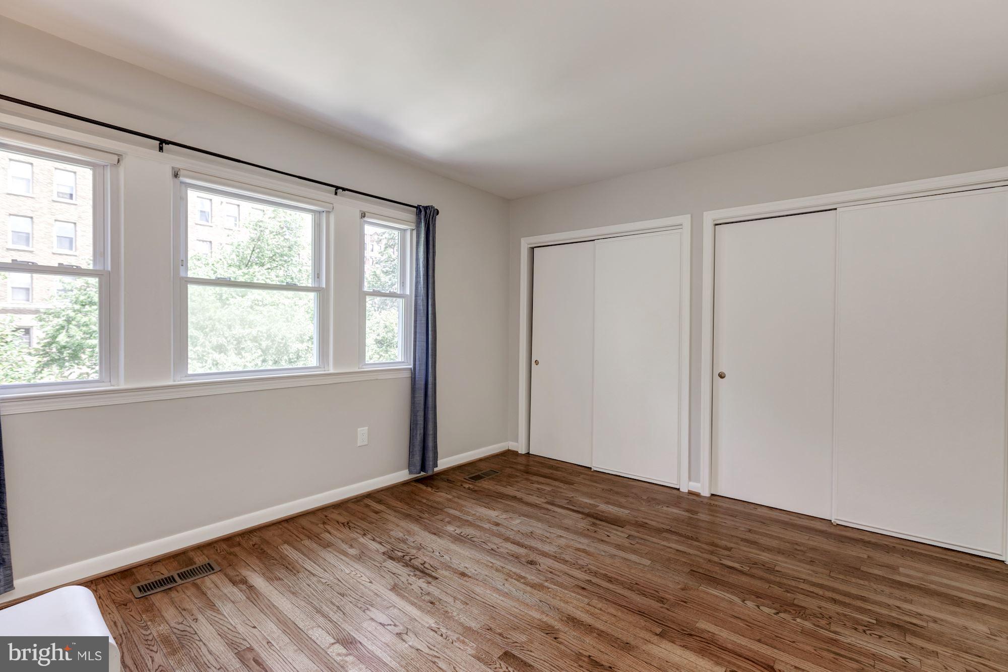 1910 17th Street Northwest Washington, DC 20009 - Photo 15 of 30 a view of empty room with wooden floor and fan