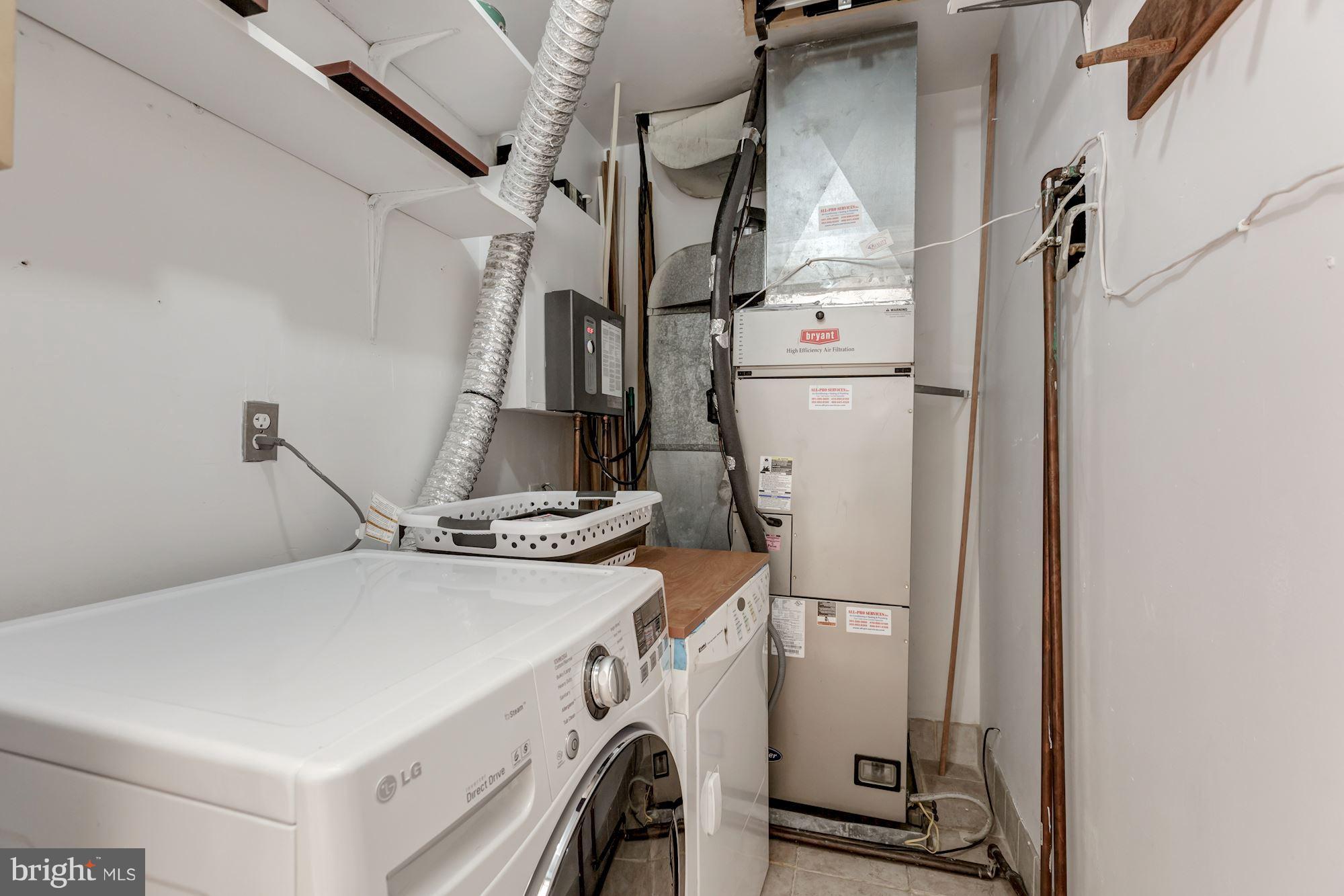 1910 17th Street Northwest Washington, DC 20009 - Photo 16 of 30 a utility room with dryer and washer