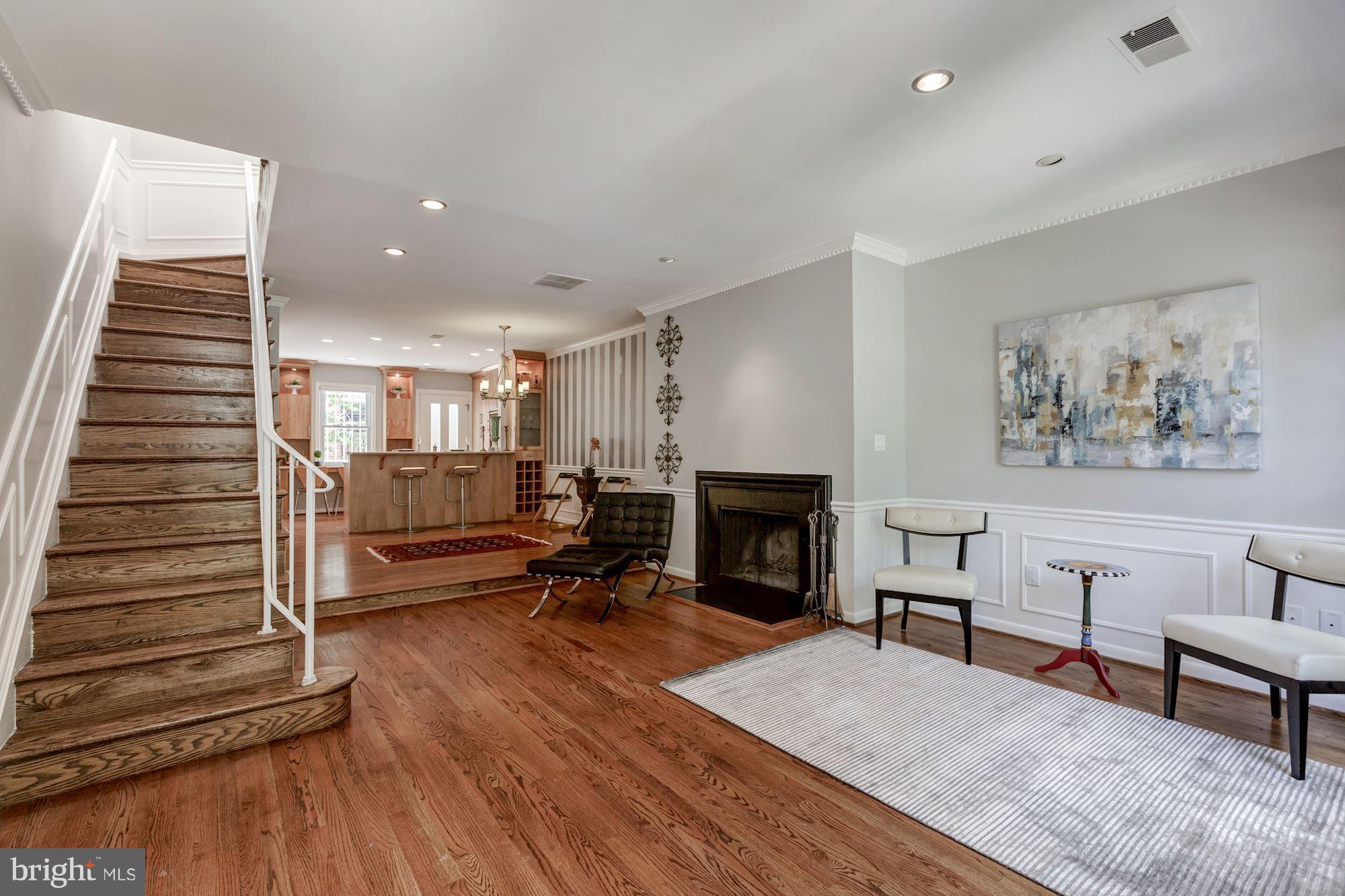 1910 17th Street Northwest Washington, DC 20009 - Photo 3 of 30 a living room with furniture and a fireplace