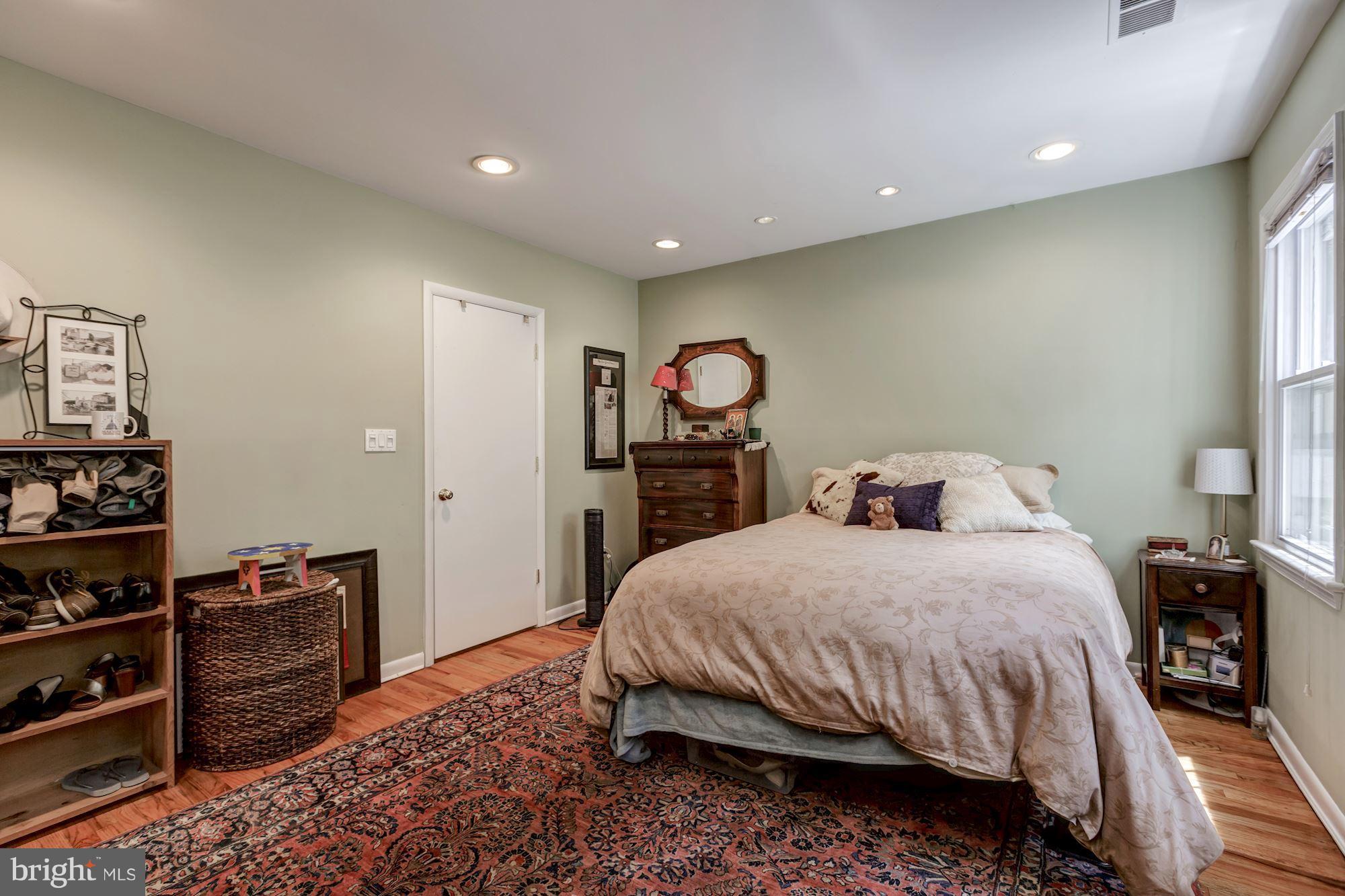 1910 17th Street Northwest Washington, DC 20009 - Photo 27 of 30 a bedroom with a bed and a closet