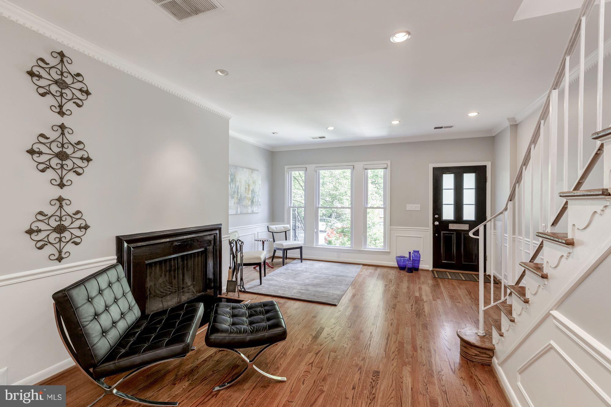 1910 17th Street Northwest Washington, DC 20009 - Photo 5 of 30 a living room with furniture and a fireplace