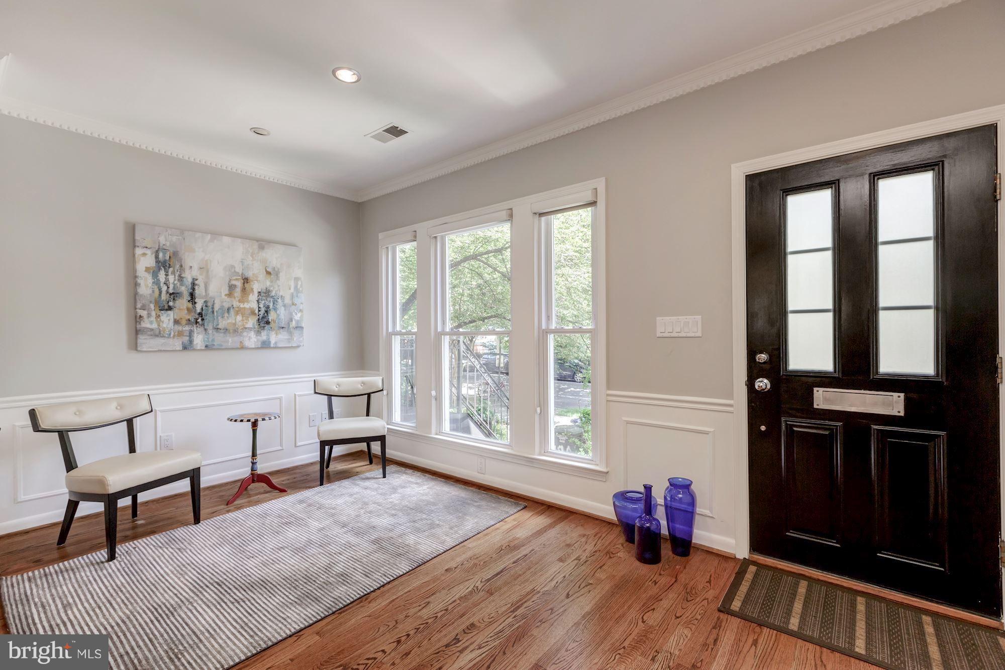 1910 17th Street Northwest Washington, DC 20009 - Photo 6 of 30 a living room with furniture and a window