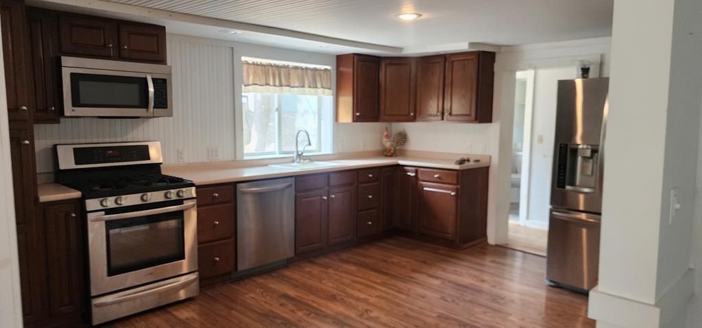 422 St Charles Road New Bethlehem, PA 16242 - Photo 8 of 13 a kitchen with a stove a sink and a microwave