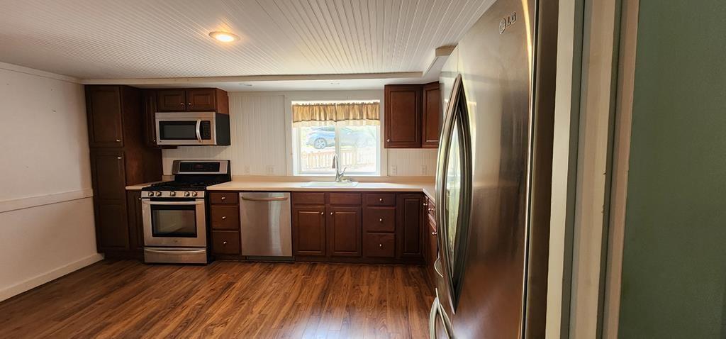 422 St Charles Road New Bethlehem, PA 16242 - Photo 9 of 13 a kitchen with a refrigerator and a stove top oven