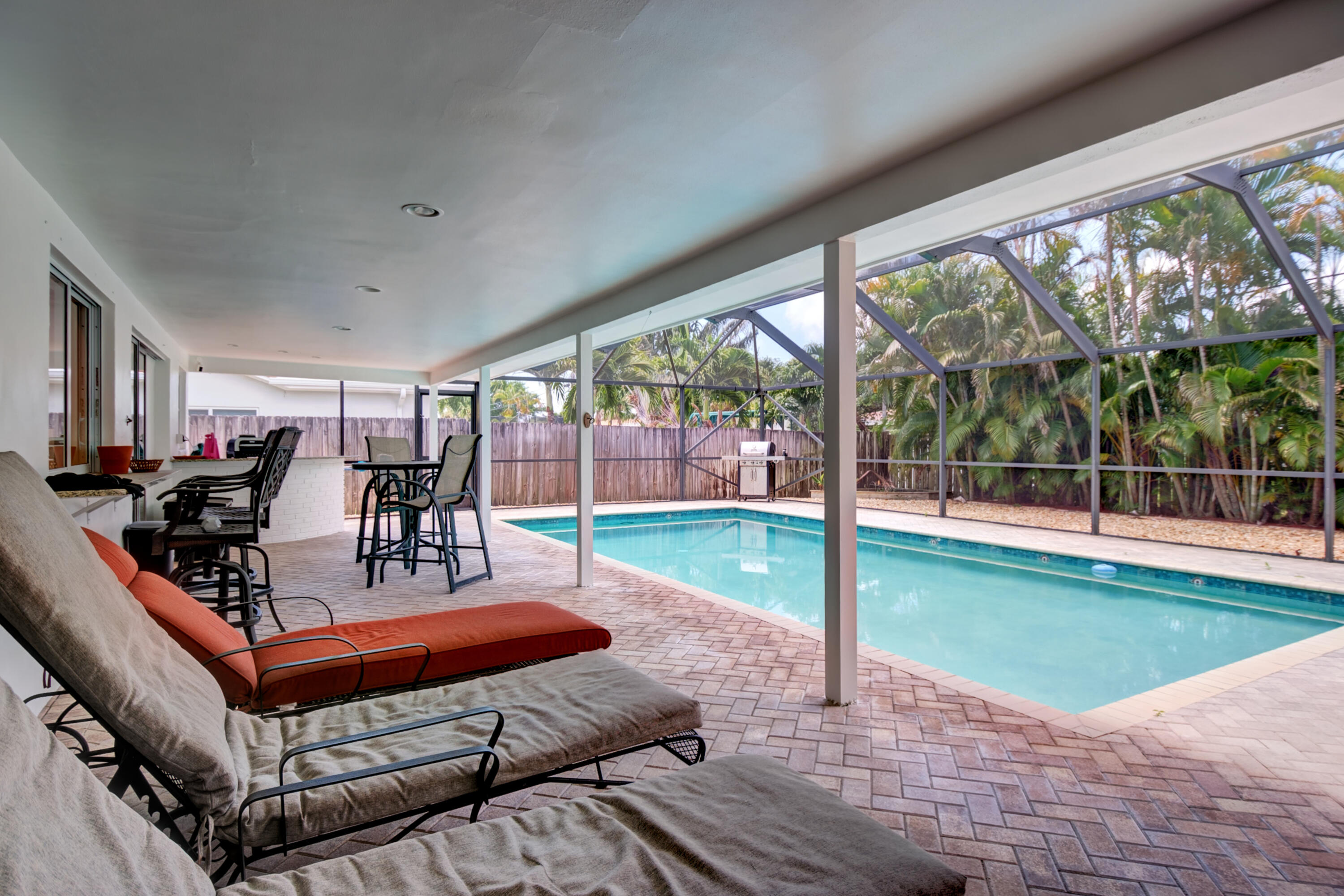 1348 Southwest 4th Street Boca Raton, FL 33486 - Photo 25 of 44 a view of a patio with dining table and chairs