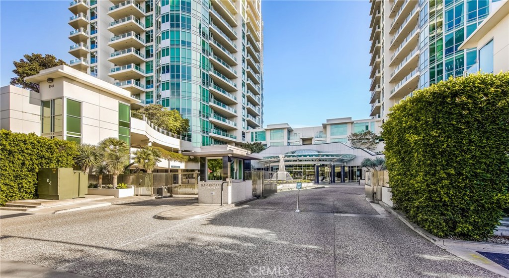 3131 Michelson Drive, Unit 606 Irvine, CA 92612 - Photo 2 of 32 front view of a building with a bench