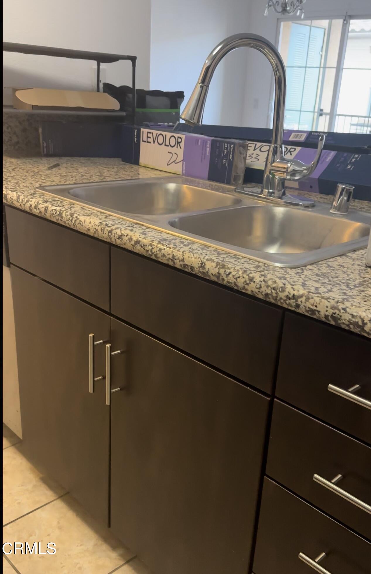 361 Riverpark Boulevard, Unit 303 Oxnard, CA 93036 - Photo 2 of 6 a close view of sink and tap