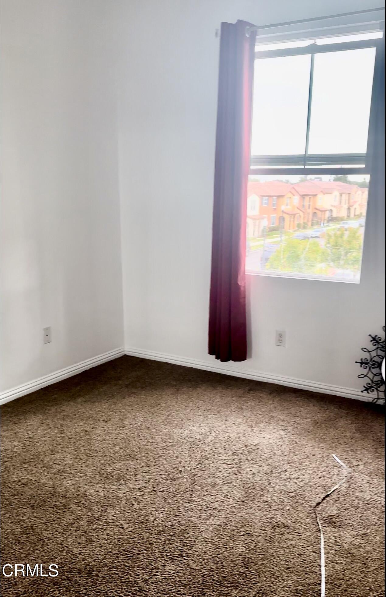 361 Riverpark Boulevard, Unit 303 Oxnard, CA 93036 - Photo 5 of 6 a view of a room with window