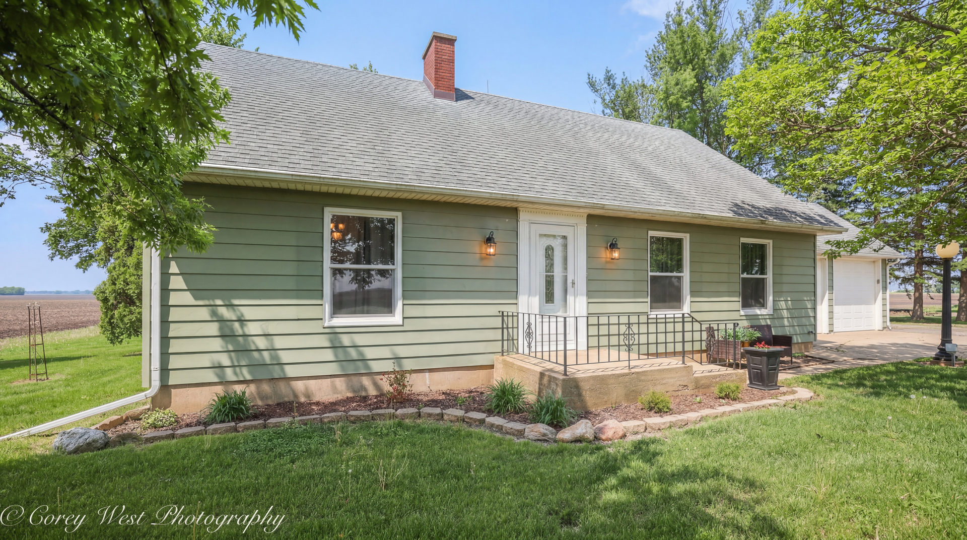 8994 Highway 64 Sycamore, IL 60178 - Photo 2 of 37 a front view of a house with a yard and porch