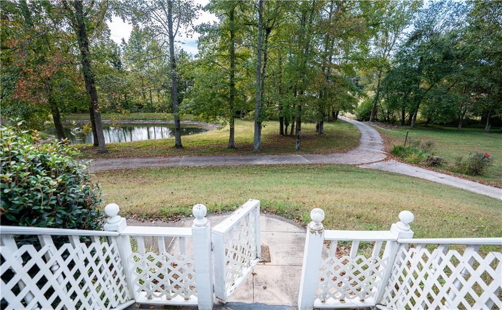 611 Couch Road Dawsonville, GA 30534 - Photo 12 of 26 a view of a garden with wooden fence