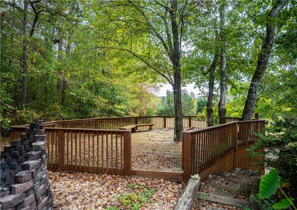 611 Couch Road Dawsonville, GA 30534 - Photo 13 of 26 a wooden fence with trees in the background