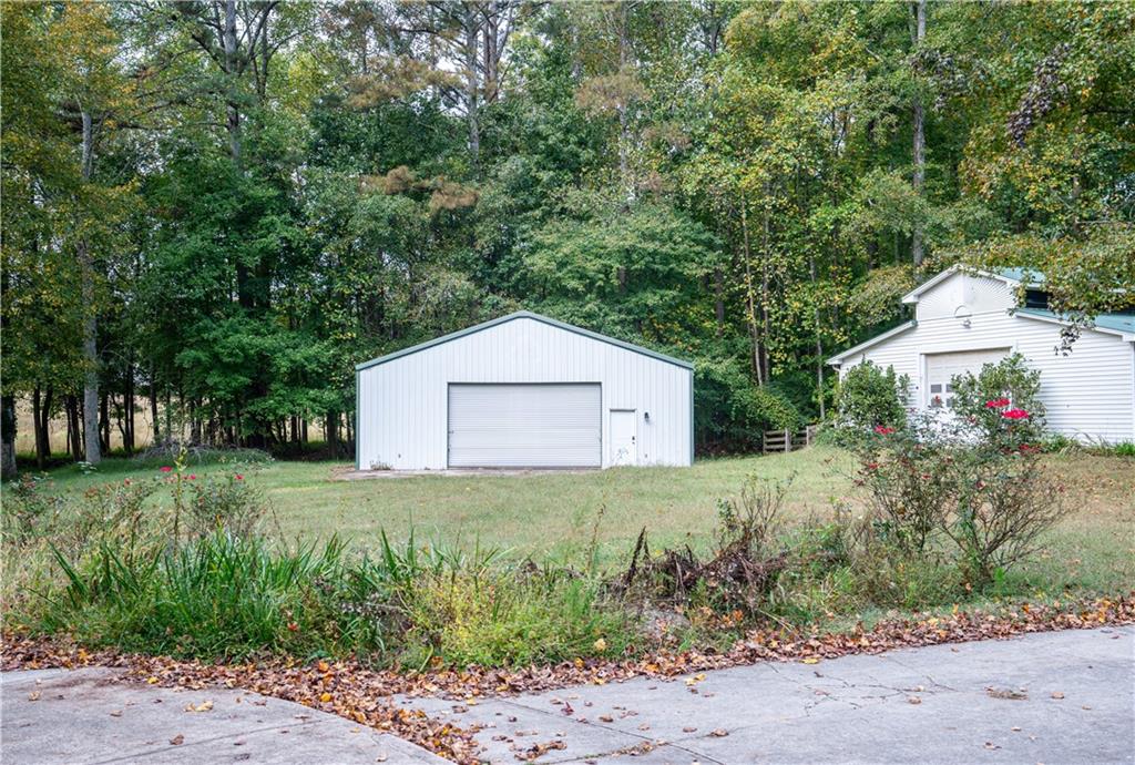 611 Couch Road Dawsonville, GA 30534 - Photo 15 of 26 a white house that has a tree in it