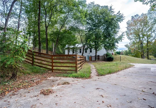 a view of a large yard with large trees