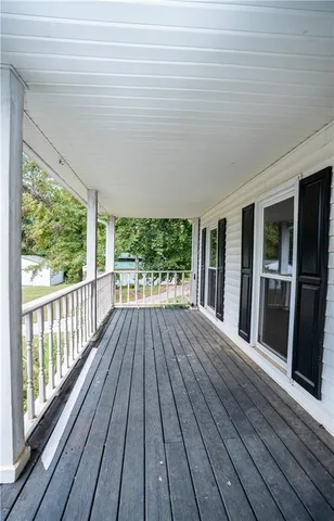 a view of outdoor space with wooden floor and entrance