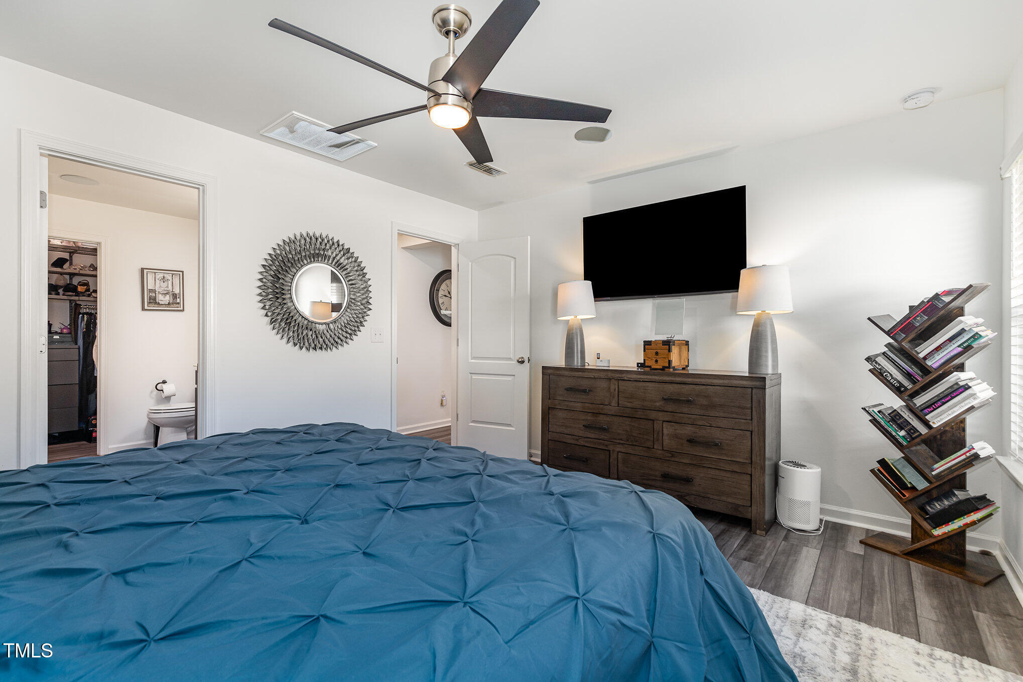 1012 Ringhill Blf Drive Durham, NC 27704 - Photo 17 of 22 a bedroom with a bed and a flat screen tv