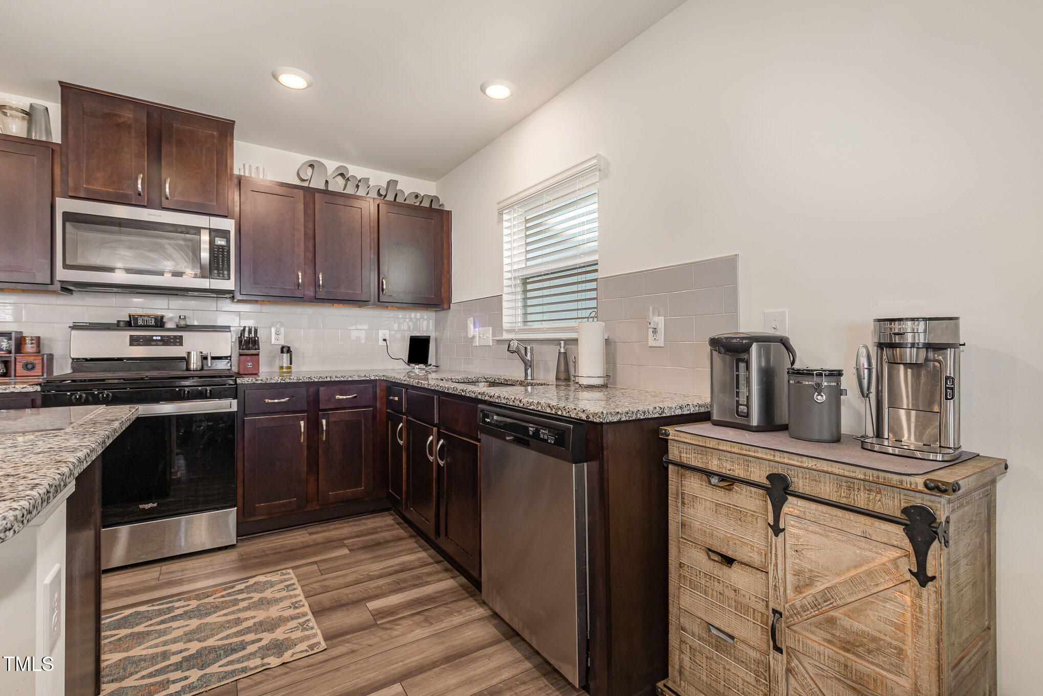 1012 Ringhill Blf Drive Durham, NC 27704 - Photo 10 of 22 a kitchen with stainless steel appliances granite countertop a stove a sink dishwasher and a refrigerator