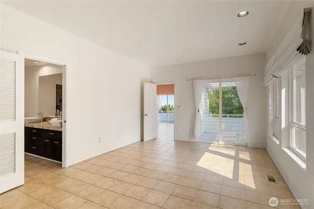 a view of an entryway with wooden floor and a livingroom view
