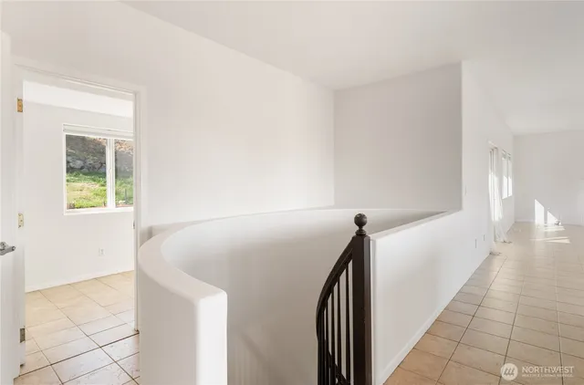 a view of a hallway with staircase