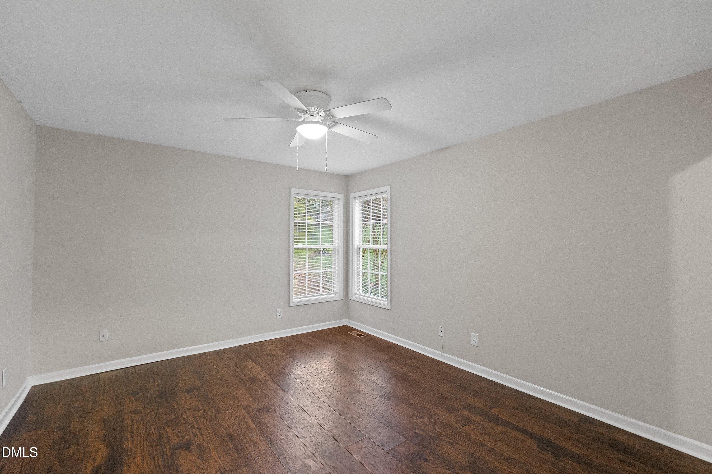 140 Melksham Road Wake Forest, NC 27587 - Photo 29 of 34 a view of empty room with wooden floor and fan