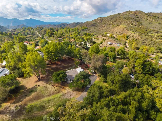 an aerial view of a house with mountain view
