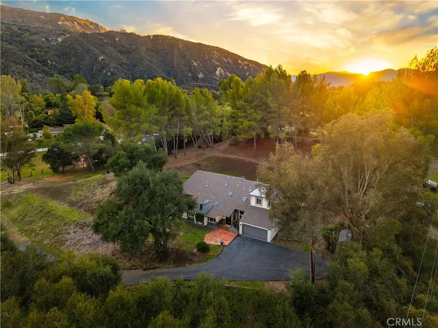 a view of a house with a yard porch and sitting area