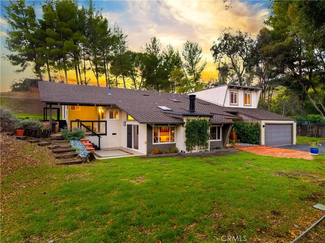 a view of a house with basketball court