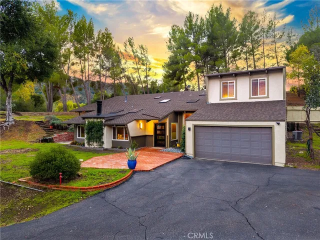 a view of a yard with plants and a trees