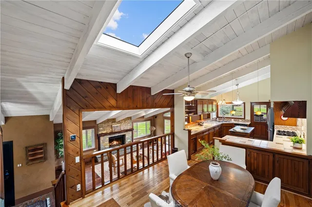a view of a chairs and table in a balcony