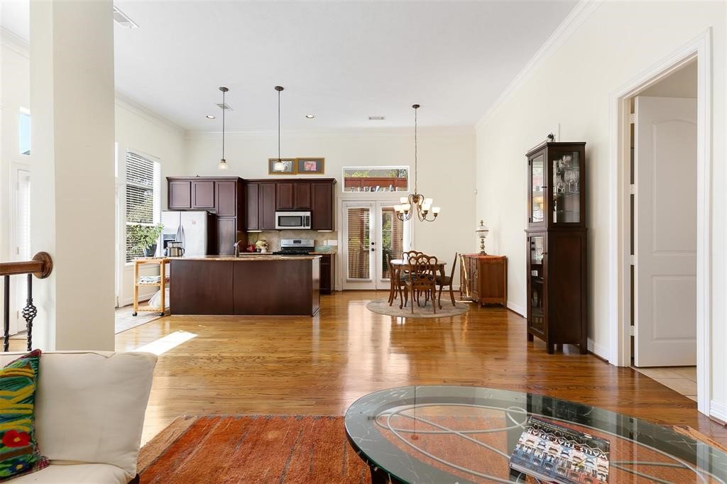 4316 Eli Street Houston, TX 77007 - Photo 4 of 20 a kitchen with stainless steel appliances granite countertop a refrigerator a stove and a sink cabinets with wooden floor