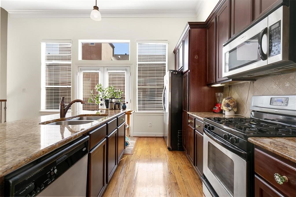 4316 Eli Street Houston, TX 77007 - Photo 6 of 20 a kitchen with stainless steel appliances granite countertop a stove and a sink