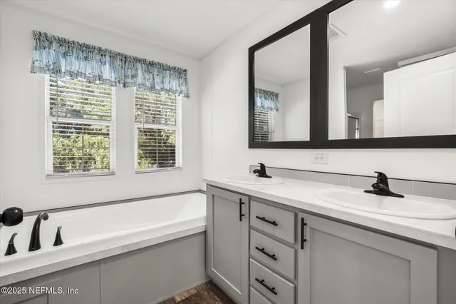 a bathroom with a sink and a bathtub