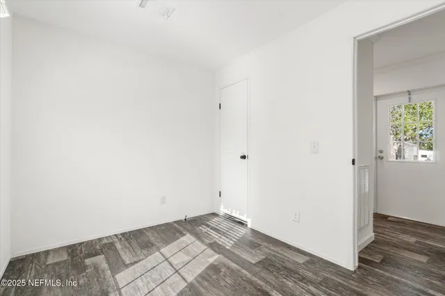 a view of a porch with wooden floor and bench