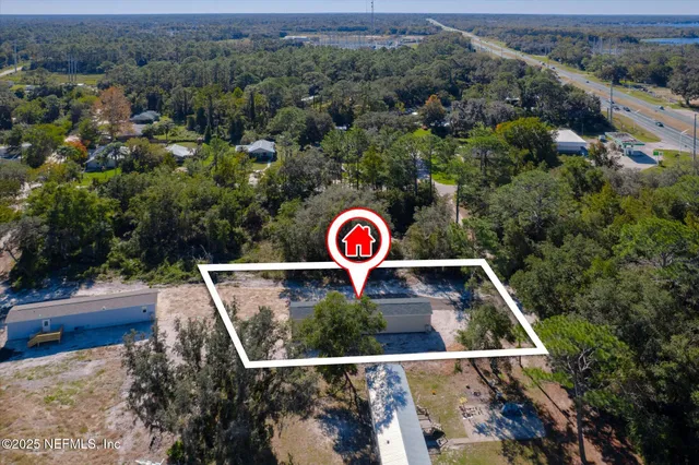 an aerial view of a red and white house