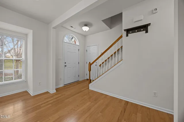 a view of livingroom with window and hardwood floor