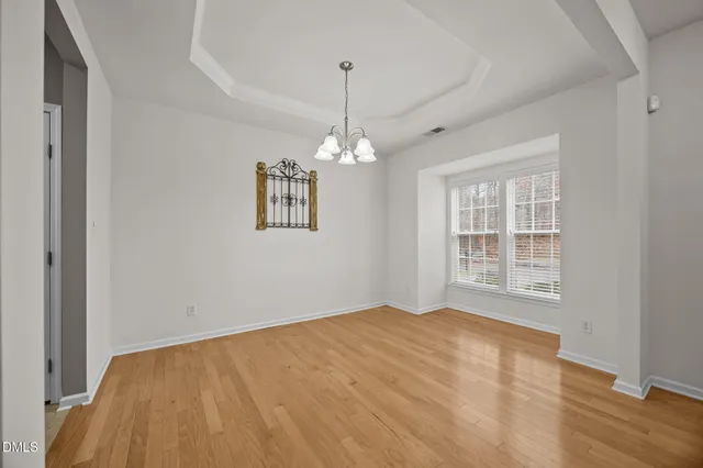a bathroom with a sink and mirror with bathtub
