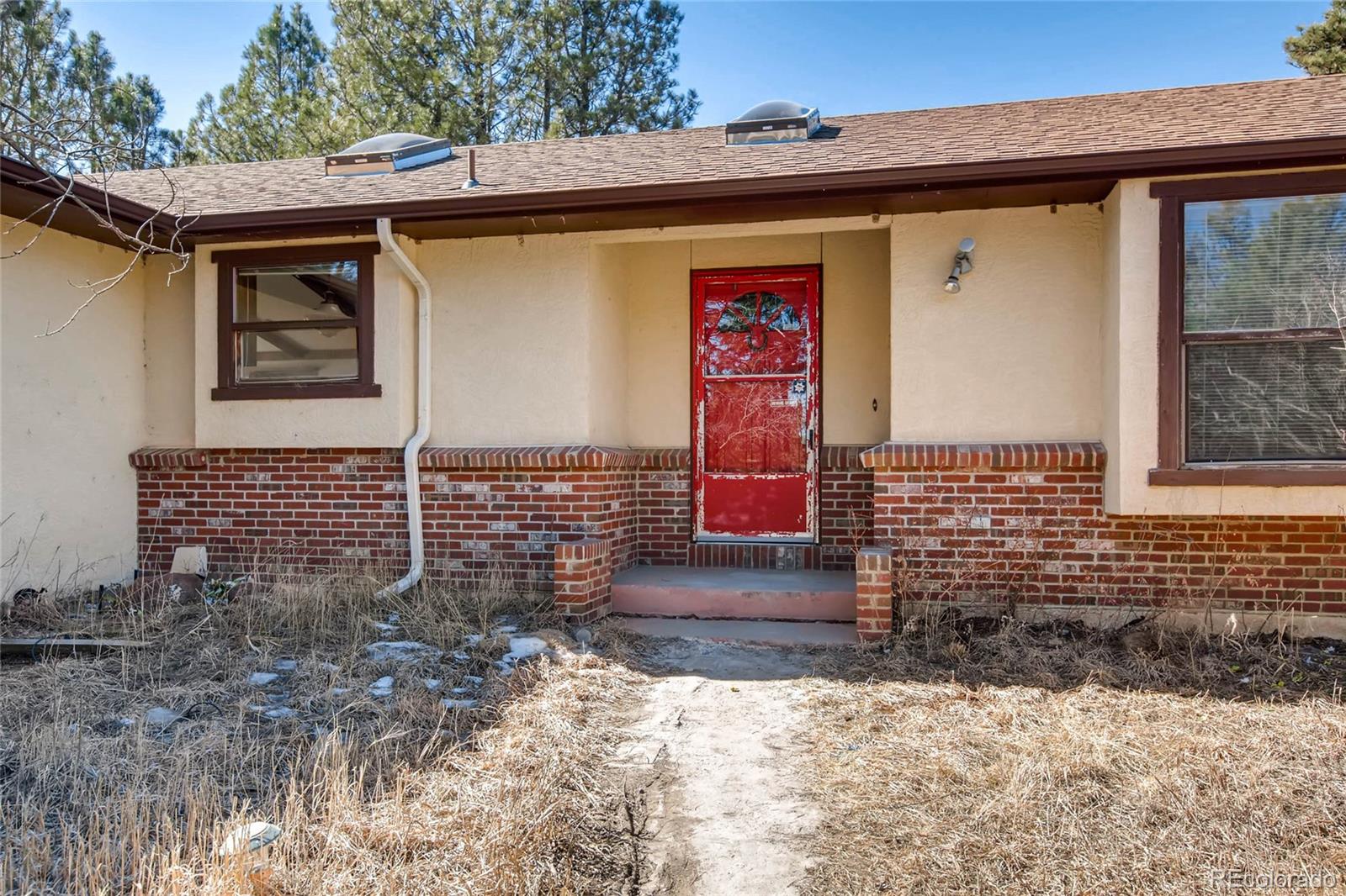 18755 Ranch Hand Road Peyton, CO 80831 - Photo 3 of 27 a front view of a house