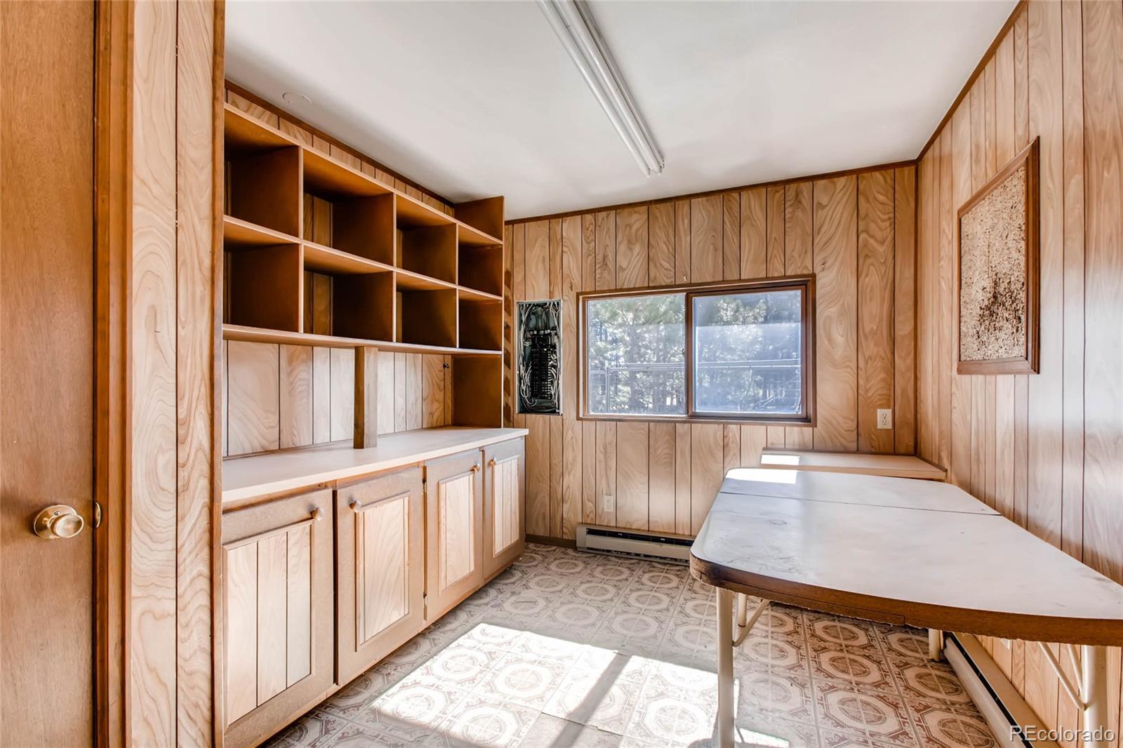 18755 Ranch Hand Road Peyton, CO 80831 - Photo 8 of 27 a view of an empty room with a window and wooden floor