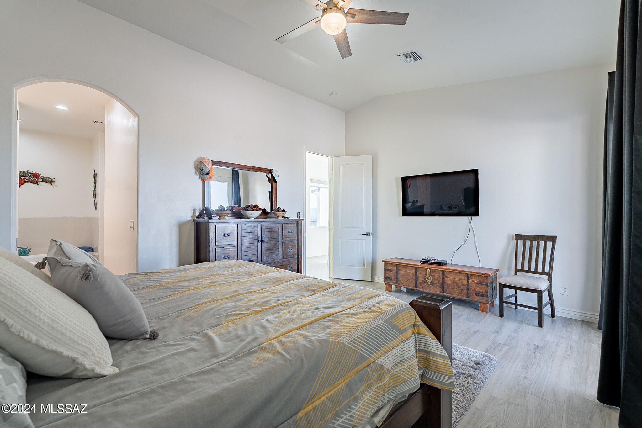 176 Avenida Ostion Rio Rico, AZ 85648 - Photo 21 of 48 a bedroom with a bed and a flat screen tv