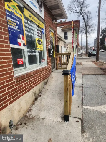 a view of a street with stores
