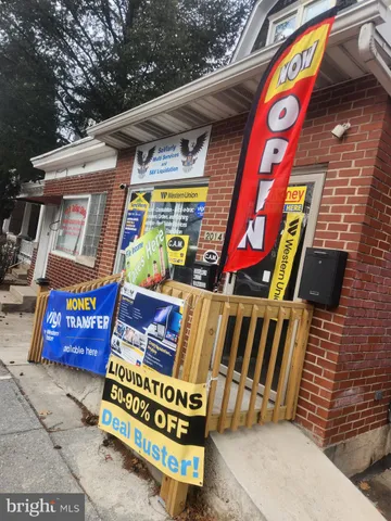 a street sign that is on a brick wall