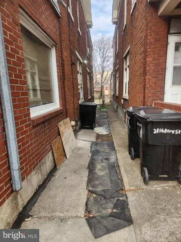 a view of a brick building with many windows