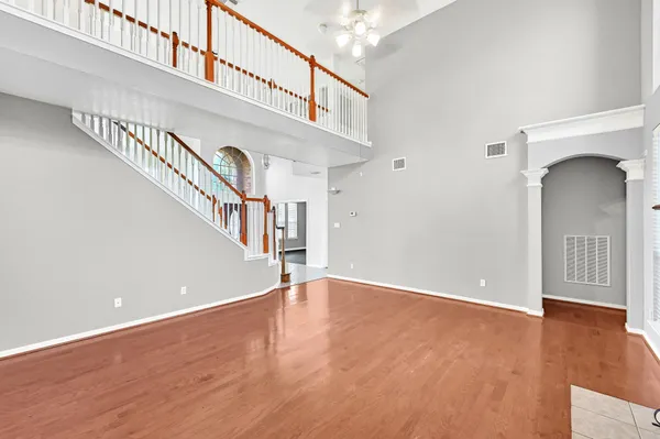 a view of an entryway with wooden floor