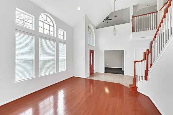 a view of an entryway with wooden floor