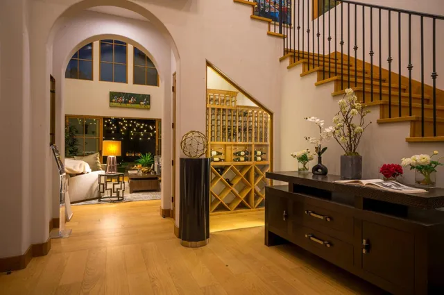 a kitchen with a sink a stove and chairs
