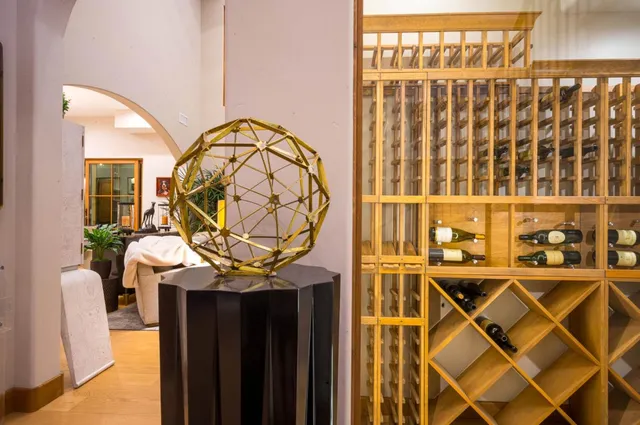 a kitchen with stainless steel appliances a refrigerator and a cabinets