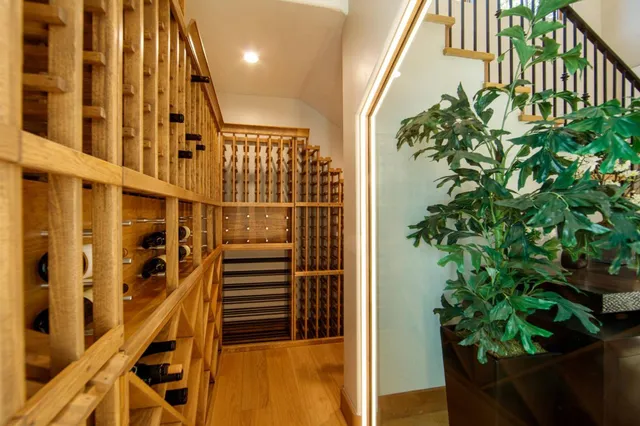 a dining room with stainless steel appliances kitchen island a table and chairs