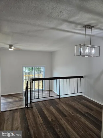 a view of staircase with wooden floor
