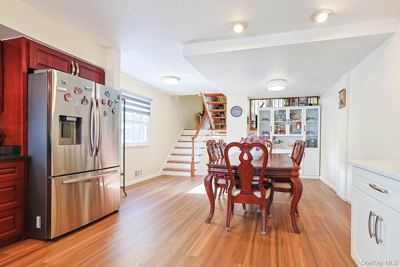 197 Park Drive North Staten Island, NY 10314 - Photo 12 of 37 a view of a dining room with furniture and wooden floor