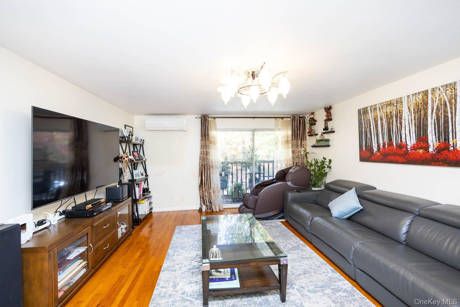197 Park Drive North Staten Island, NY 10314 - Photo 20 of 37 a living room with furniture and a flat screen tv