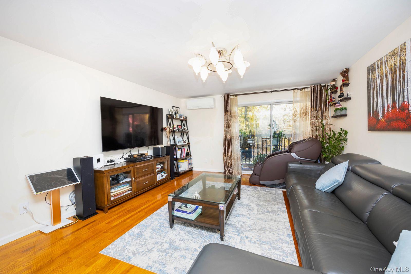 197 Park Drive North Staten Island, NY 10314 - Photo 21 of 37 a living room with furniture and a flat screen tv